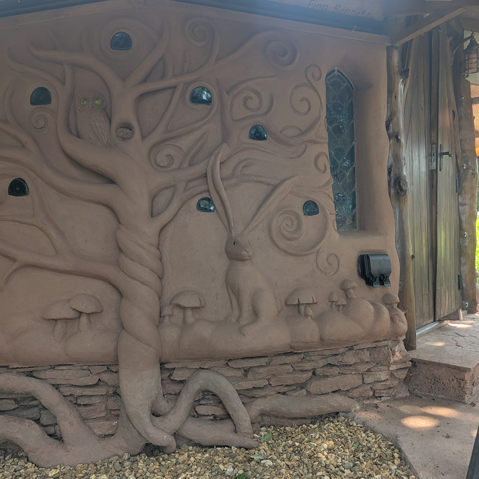 Outside of Earth Themed Cob Glamping Pod